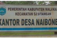 Papan Nama Kantor Desa Naibone Kecamatan Sasitamean.(foto- istimewa) 