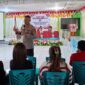 Kapolres Malaka AKBP Riki Ganjar Gumilar Memaparkan Materi di Seminar Internasional Wemo'ns Day Yang Diselenggarakan GMNI Cabang Malaka. (Foto-red)